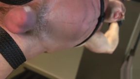 Spandex BDSM stud gets handjob from dom hunk