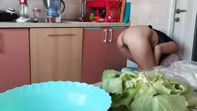 Sexy MILF strips in kitchen, fingering her hairy pussy