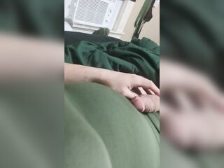 Stroking in a green costume and fake boobs