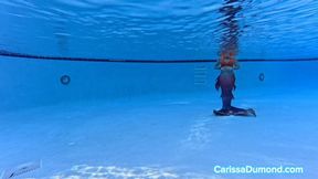 Carissa as a Mermaid in the pool at the resort