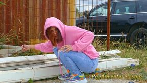 Girl with a hoodie pee trough her jeans