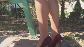 Red high heels in the garden