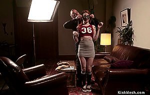 Blindfolded slave is locked in stocks