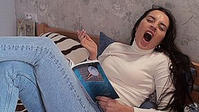 Yawns in front of a book!!! (1920x1080 Full HD) MOV