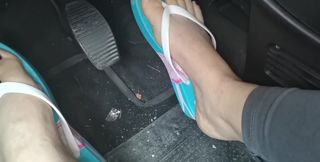 Sweaty Feet in Really Tasty Flip Flops Pedal Pumping on the Pedals of the Car