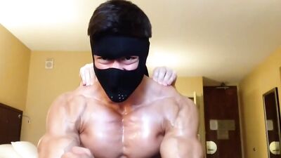 Masked dude shows his strong body and flexes those muscles