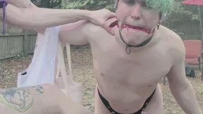 My naked sissy slave in chastity gets all wet while he holds my bags and keeps me dry during the rain, I reward him by beating his pathetic balls!