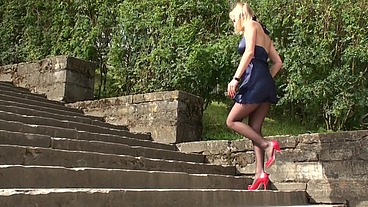 Sexy Blonde In Blue Mini Dress and Black Pantyhose With No Panties Flashing Underneath
