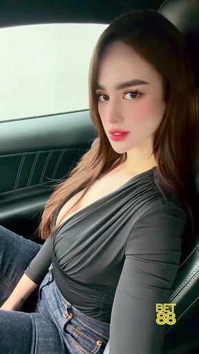 Brunette Filipina celebrity shows off her curves in a car
