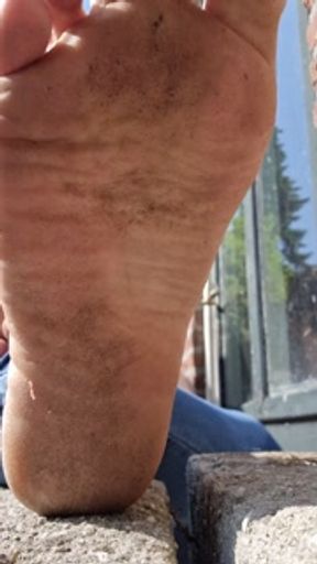 Showing my really dirty feet and wrinkled them in the sun.