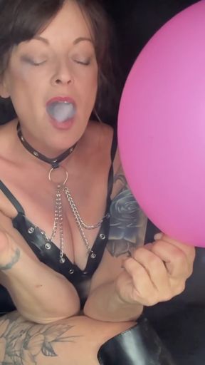 Smoking hot babe pops balloons for fun