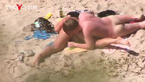 Young man and girlfriend get naughty on sunny beach