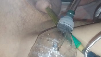 Pissing In A Bottle Closeup Through A Hose