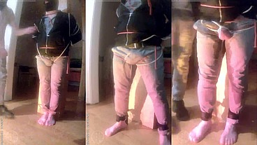 pee desperation: tied up by his flatmate, this guy tries to resist while his cock and balls are played with. He gets a boner and finally wets himself