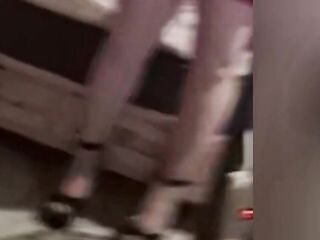 Dude wearing hot red dreas hose and heels