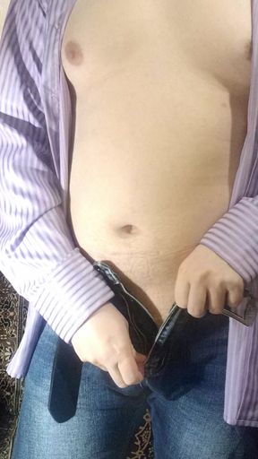 Slowly unbuttoning my pants...