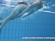 Cute Umora is swimming nude in the pool