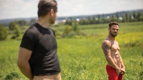 Curios cyclists in the middle of an open field