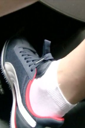 Driving in Blue Nike Sneakers and White Socks