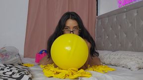 Marianna dresses in the same color as her balloons to make them pop!