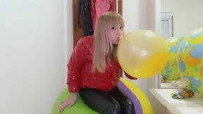 Alla rides on a big beach ball and wears a glossy down jacket and leather leggings and inflates a balloon with her mouth!!!