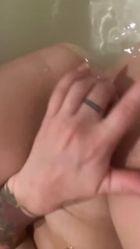 Water masturbation in a full bath, I cum right into the water and continue fingering