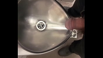 Pissing in a public toilet