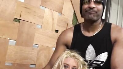 Lustful blonde swallows a huge black dick and anal rides