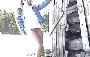 Sexy blonde strips naked in the snow