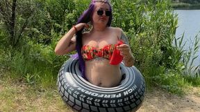 Valeri in swimring b2p red balloon on beach