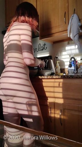 Nude making breakfast on vacation