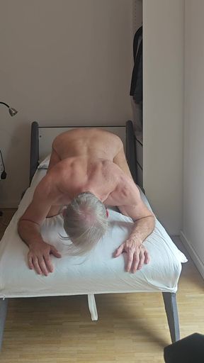 Naked stretched in a bed