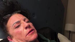 Goddess Kandy sneezes while resting in a classic hotel bed