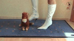 Stuffed Toy under High Heel Boots