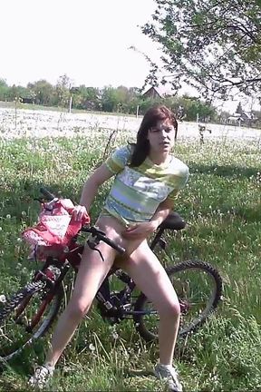 Peeing on her bicycle