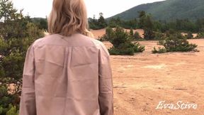 Mommy pisses on the beach, blowing a jet while standing on all fours