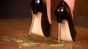 Attractive Girl Crushing Some Fruits With Her High Heels Shoes And Feet