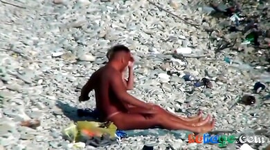 Tanned couple in pink thongs take their anal play to a rocky public beach