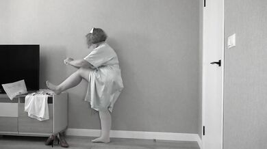 Nurse stripping down into her worn clothes for you