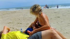 Hot mature gives big cock a public handjob