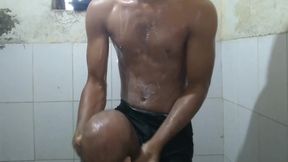 The boy masturbating inside bathroom.