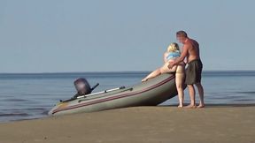 MILF blonde beach babe takes it in the sand