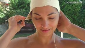 ”Hungarian baddy Lidia gets horny underwater with snatch”