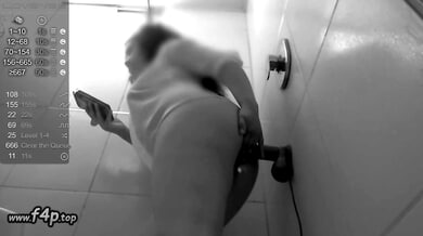 Curvy dark-skinned woman trains deep anal stretching in black and white bathroom selfie