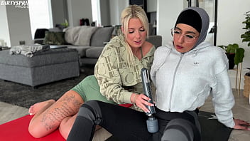 Emily shows hijab wearing Aaliyah how to relax after their gym workout