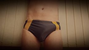 growing erection in swimming trunks