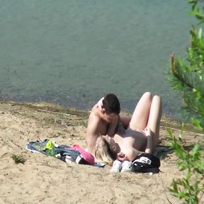 A couple of young nudists are spied on while having sex and