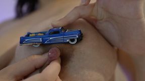 Giantess girl plays with tiny man and tiny cars, sucks them like candy and drips milk on them from her big breasts
