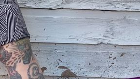 Beige flat with black bow in mud