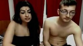 Some nerdy guy is fucking a hot MILF in front of the webcam